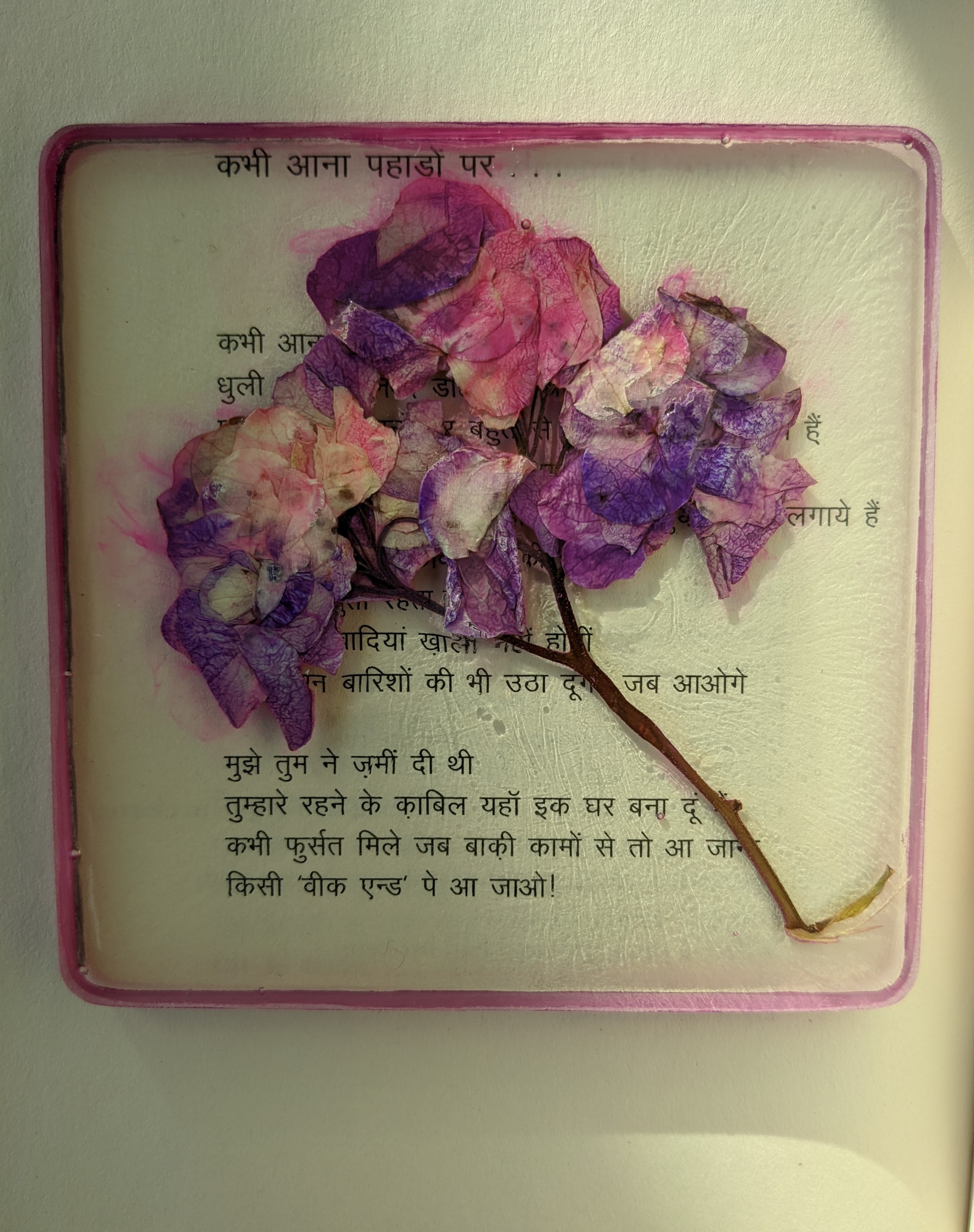 Resin coaster with a pink embedded flower