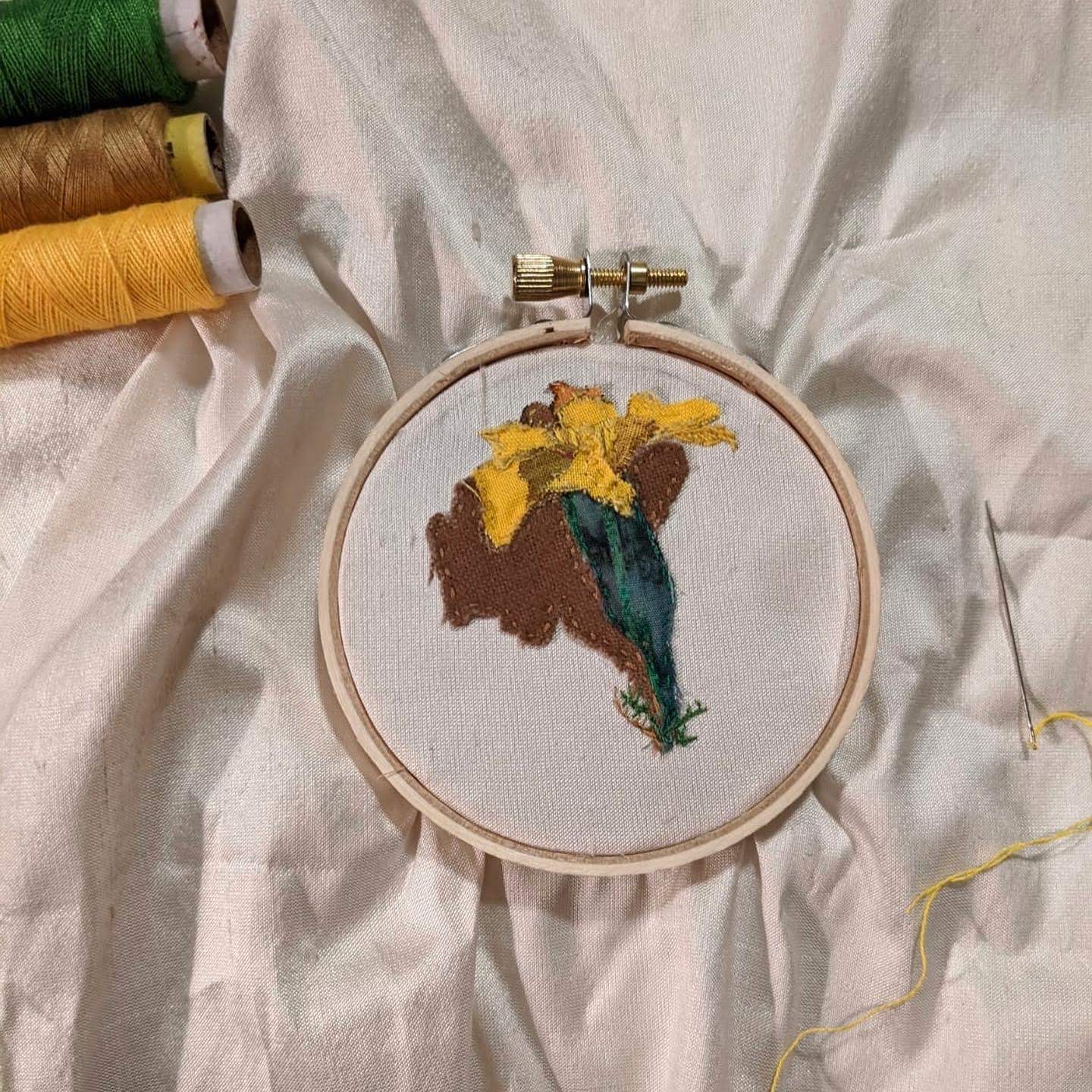 Embroidery photo of a marigold flower